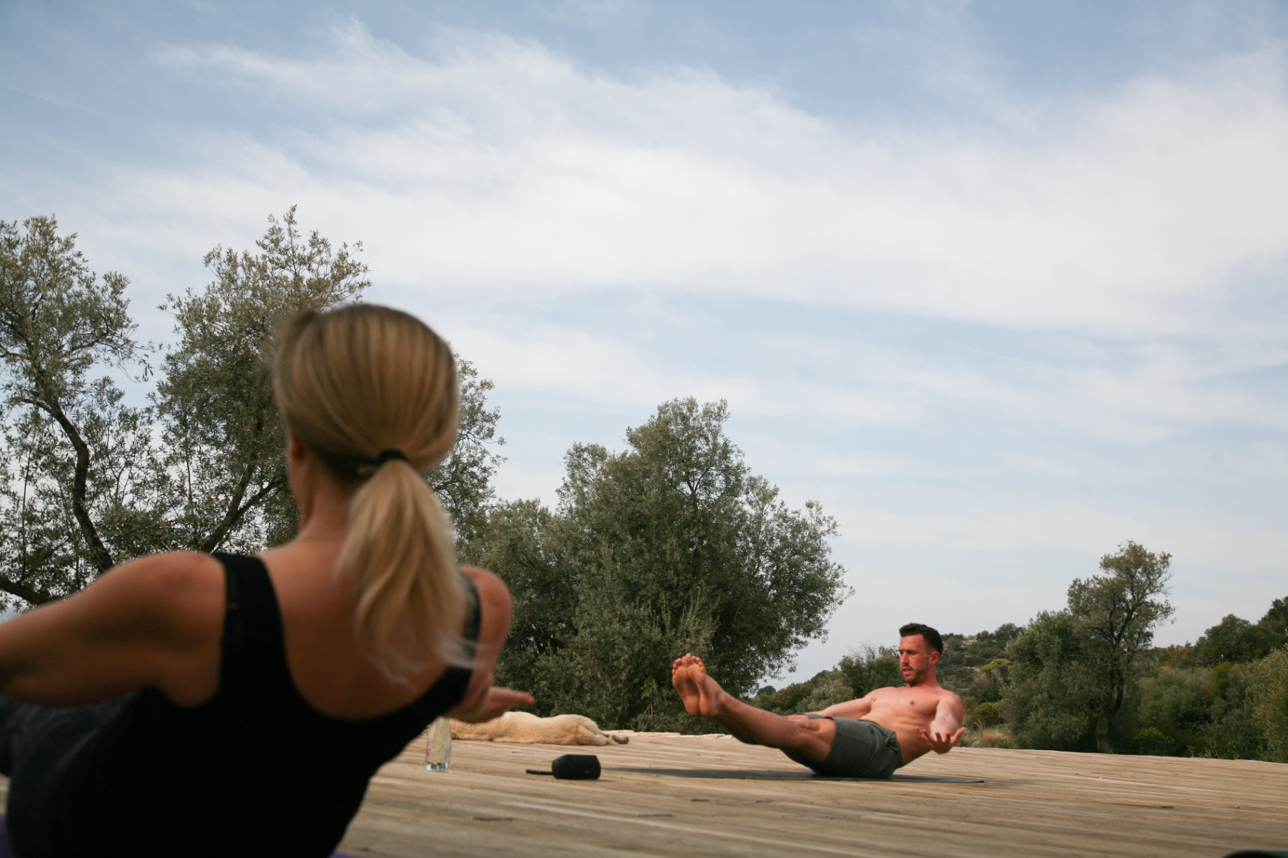 Client holding a controlled core position — trunk strength work for lower back pain